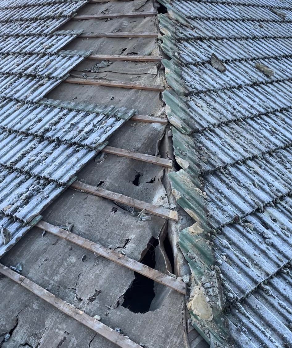 seriously damaged pitched roof