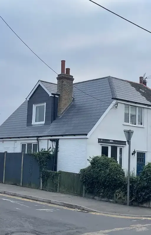 recently repaired pitched roof on side of property